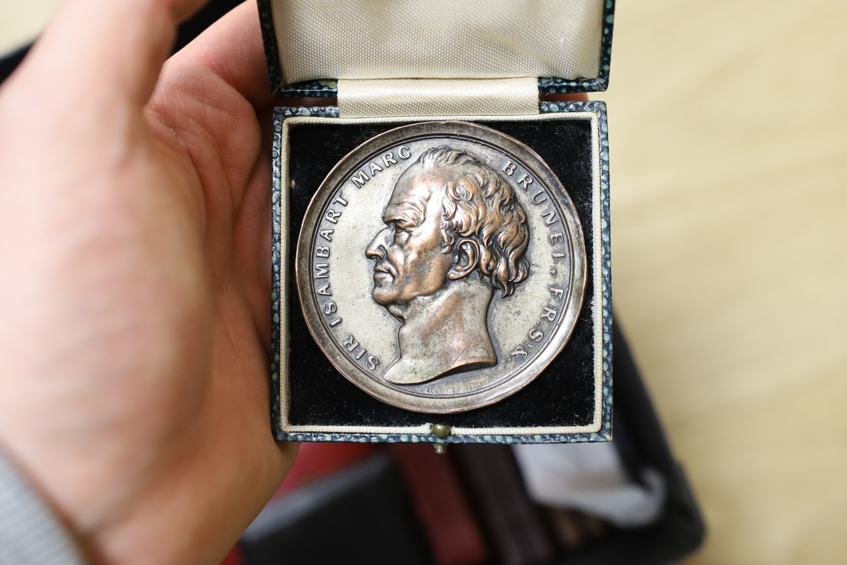 A large and varied collection of mostly continental cast metal commemorative medallions, to include political, musical and other cultural subjects together with two Japanese cased medals (quantity)